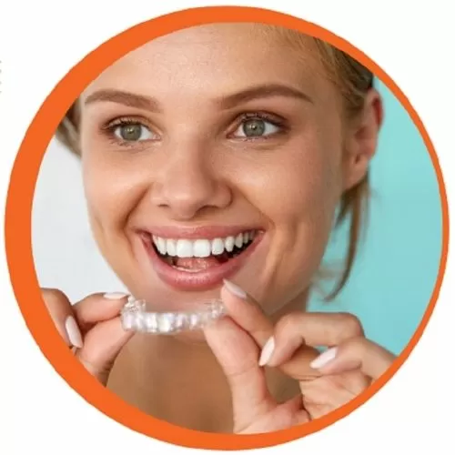 Woman smiling with custom teeth whitening trays