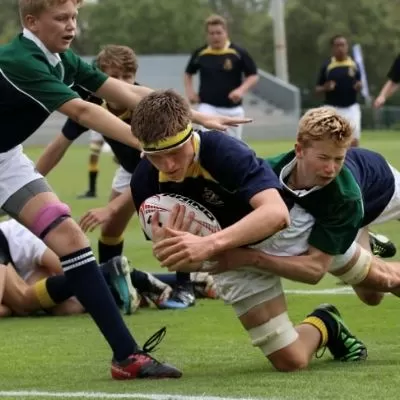 A rugby player scores while wearing a custom rugby mouth guard